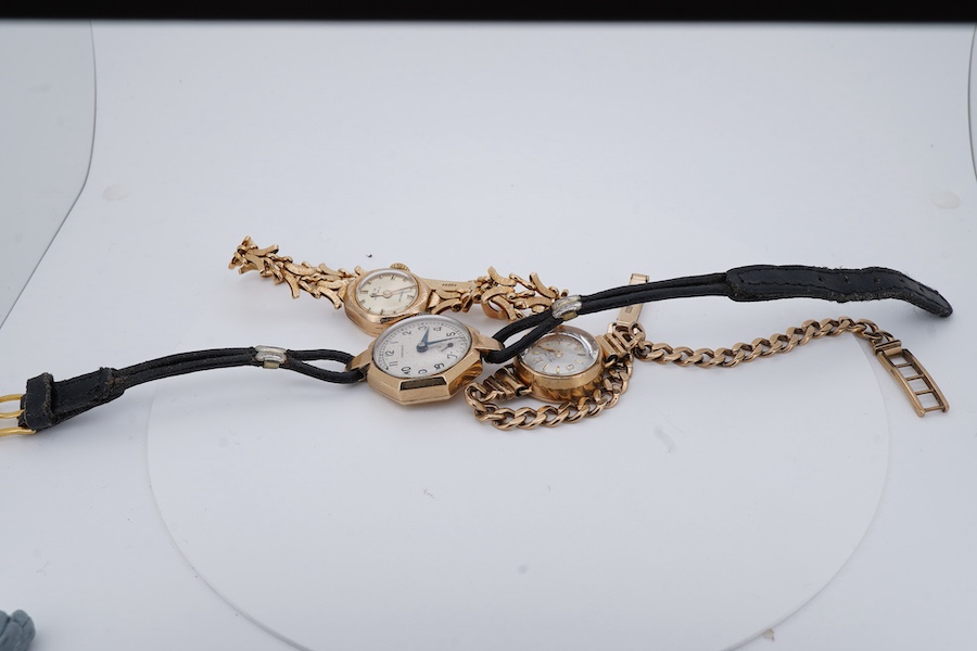 Three lady's 9ct gold wristwatches, mid 20th century, comprising: a gold wristwatch by Record, with a curb link strap; another wristwatch by Avia with a fancy link strap, combined gross weight approximately 23.5 grams; a